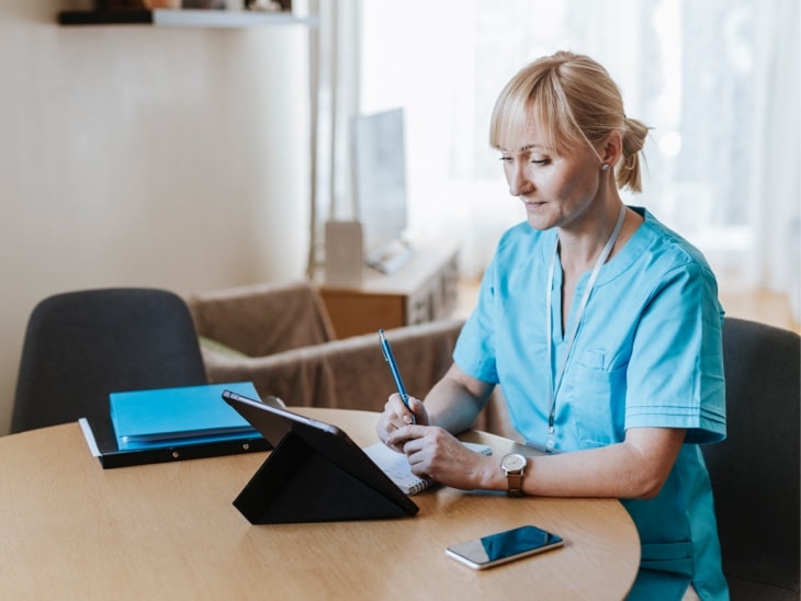 Healthcare provider working from tablet